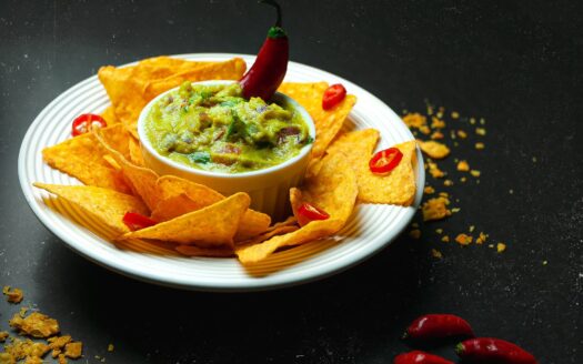 brown and green food on white ceramic round plate