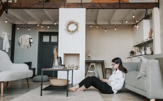 woman sitting on the floor using a laptop