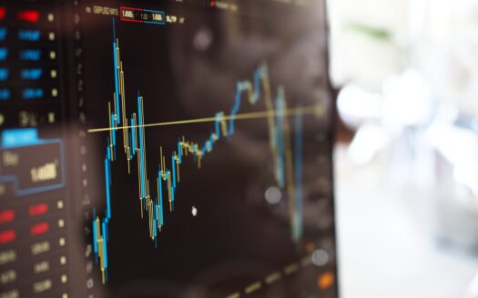 blue and yellow graph on stock market monitor