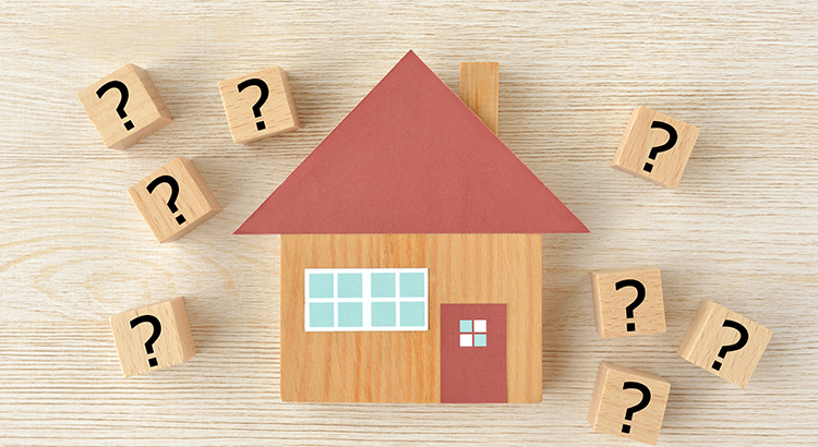 House object and wooden blocks with question mark