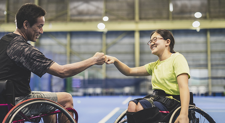 Asian adaptive teenage girls playing wheel chair tennis.