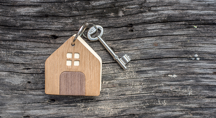 House  keys on wooden floor background