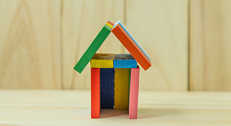 The home toy on wood for property content.
