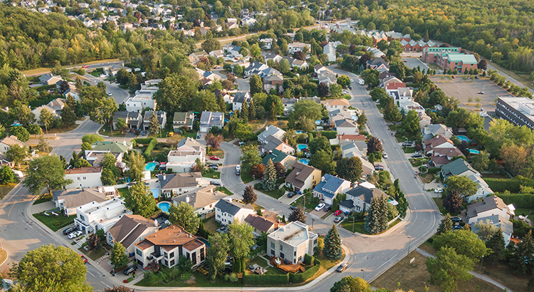 Aerial view of houses and streets in beautiful residential neighbourhood in Montreal, Quebec, Canada, North America. Property, homes and real estate concept, summer season.