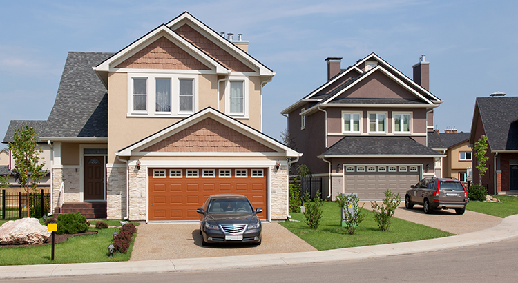 Construction of new building luxury suburban houses in sunny summer afternoon. House hunting