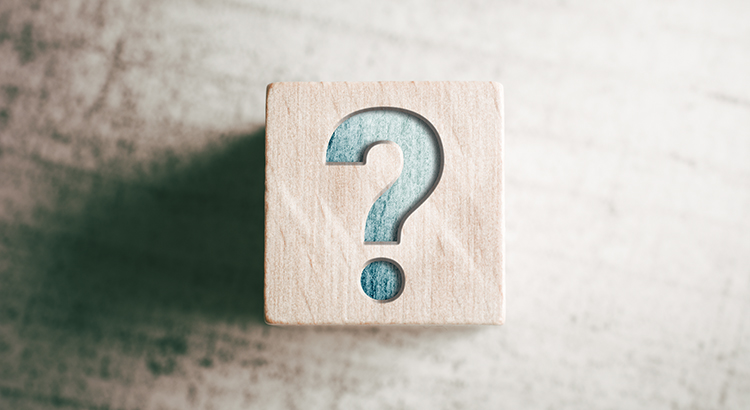 Question Mark On Wooden Block On A Table