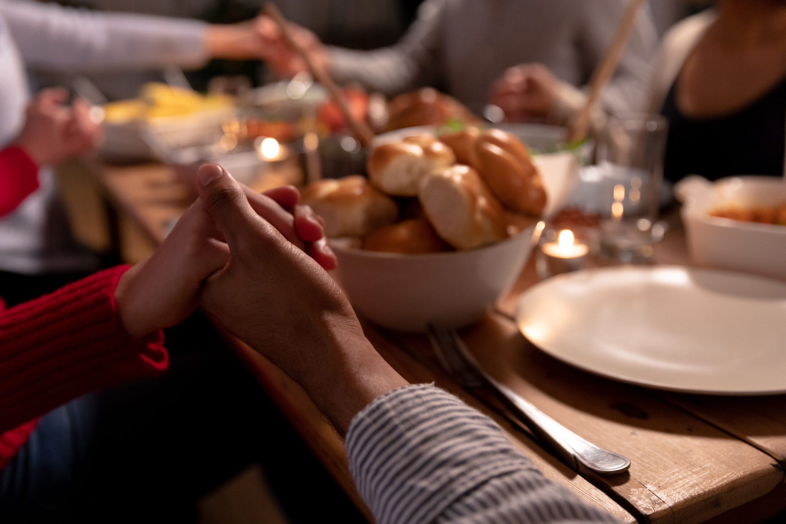 Millennial adult friends celebrating Thanksgiving together at ho