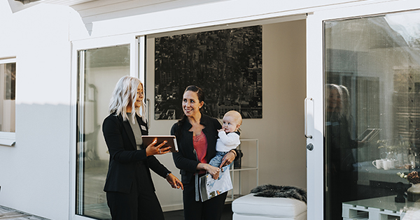 Estate agent showing woman house