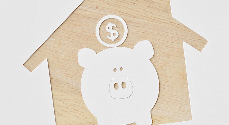 Piggy bank and buying a house project - Saving money for future concept